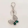 패션 크리스탈 나비 키 체인 반짝이 모조 다이아몬드 금속 키 반지 패션 세련된 가방 펜던트 생일 선물