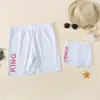 Famille correspondant tenues maman et fille maillot de bain d'été lettre imprimer vêtements papa garçons plage shorts costumes décontractés 210429