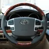 Convient pour Toyota Crown Land Cruiser Landkuluze Overbearing Prado Peach Grain de bois cousu à la main Housse de volant en cuir