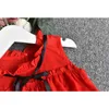 女の子セット夏の赤ん坊の服のノースリーブの弓Tシャツ+チェック柄のボタンショートパンツ2ピースの子供210515