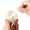 Pot en verre givré Bouteille de crème pour le visage Pots cosmétiques ronds Récipient brun ambre Bouteilles d'emballage transparentes 5g 10g 15g 20g 30g 50g avec couvercle en grain de bois imité