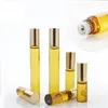 Garrafa de perfume de fragrância 3ml 5ml 10ml mini rolo em vidro âmbar marrom espesso espessura óleo de óleo de aço de rolos de metal DH8576