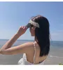 Женские шляпы соломенные козырьки для широкого раскола ультрафиолетовой защиты от ультрафиолетовой защиты пляж Топлес Жемчужные Солнце Шляпы