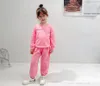 Designer Kids Kläder uppsättningar 2021 Höst Baby Girls Tecknade brev Tryckta Långa SleVe Toppar + Kjol / Byxor 2st Passar Barn Sport Outfits S1700