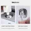 GESEW Magnetic Toothbrush Holder Bathroom Automatic Toothpaste Dispenser Wall Paste Toothpaste squeezer Bathroom Accessories Set 210322