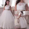 2017 White Princess Flower Girl Wedding Dresses Sheer Lace Crew Neck Cap Sleeves Christmas Pageant Gowns First Communion Dresses with Sash