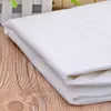 ورقة سرير تدليك بيضاء يمكن التخلص منها غطاء مسطح غلاف مقاوم للماء 10 أوراق A Pack7542710