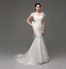 2015 Mermaid Lace Wedding Dresses in Stock Cap Sleeves Backless Bridal Bridal With Big Bow Vneck Designer Wedding Dress2857772