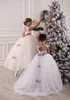 2015 Tulle Flower Girl Dresses Sheer Beaded Appliques Fluffy Christmas Ball Gowns for Wedding Keyhole Lace-up Bows Lovely Custom Made Dress