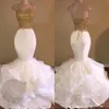2019 Sexy sjöjungfru vit och guld prom klänningar spaghetti band applikationer spets ruffles organza oäpless lång afrikansk prom klänning för gradustion