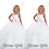 2015 Cristales Con cuentas Vestidos de desfile para niñas Ritzee Correas de espagueti Volantes de lujo Hasta el suelo Niña de las flores Vestidos formales pequeños
