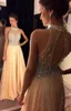 2020 Arabien Prom Klänningar High Neck Crystal Major Beading Illusion Chiffon Peach Sheer Open Back Long Party Dress Formal Evening Gowns Wear