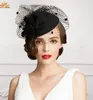 ヴィンテージの新しいスタイルの黒い色のチュール+羽のウェディングブライダル帽子のイブニング/パーティーの帽子のファッション