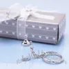 Gratis frakt 100pcs Collection Crystal Babyflaska Keychain Favors Baby Shower Idéer Party Keepsake Party Decoration Presenter