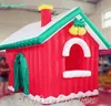 Tenda Gonfiabile Di Natale All'aperto 6m Casa Rossa Soffiata Ad Aria Cottage Gigante Del Villaggio Di Natale Per La Decorazione Di Natale Invernale