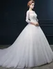 2016 Ny Hot Fashion Gratis Frakt Elegant Ball Gown Ivory Court Train Bateau Beading Appliques Tulle Bröllopsklänningar 300