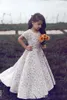 Encaje Vestidos de niña de flores para boda Joya vintage Mangas cortas Una línea Vestido de desfile de chicas Tren de barrido Cumpleaños para niños Vestido de fiesta Ropa formal