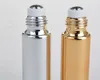 100PC / LOT FAST SPACK 10 ml Metal Roller Refillerbar flaska för eteriska oljor UV-rullade glasflaskor Guld silverfärger