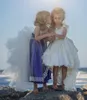 Klänningar söta vita spetsar höga låga flickor tävlingsklänningar 2016 Tiered Pärlor Ribbon Flower Girl Dresses For Wedding Ivory Kids Birthday Party