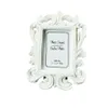 white baroque place card holders