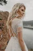 Aankomst Hollow Back Lace Trouwjurken Een lijn Sweep Train Bridal Toga Tulle Boheemse strandjurken