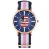 Montres-bracelets Montre à quartz avec boîtier en or rose pour femme Charmant symbole de la monnaie du dollar avec drapeau américain pour bracelet en nylon pour femme