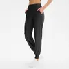 Lösa sportbyxor Kvinnors körande Yoga Joggers Pocket Fritid Snabbtorkande Fitness Leggings Workout Gym Kläder