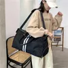 2023 Bags Clearance Outlets New cloth letter high capacity travel bag women's Waterproof Black and white strip men's sports Bag Fashion Handbags