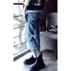 Den koreanska versionen mode ljusblå lös passande, bantning, varm, manschettig, rakt ben jeans kvinnors byxor cabris