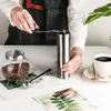 Macinacaffè argento Mini macinacaffè manuale in acciaio inossidabile fatto a mano macinacaffè macinacaffè utensile da cucina 210607