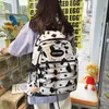 Mochilas do padrão de vaca Mulheres sacolas escolares de lona Lady Lady Capacity Travel Rucksack Bagpack fofo de estilista Mochila251j