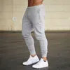 Män joggare märke manliga byxor casual byxor sweatpants jogger grå casual elastisk bomull gym fitness träning dar xxxl 210702