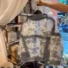 Streetwear encaje Patchwork Jean agujero chaqueta vaquera abrigo mujer de gran tamaño manga larga perspectiva flor bordado abrigo suelto 210416