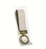 High Qualtiy Leather Keyring Holder Märke Keychain Designers Män Kvinnor Karväska Nyckelring med låda Aim990a