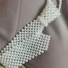手作りの編まれた真珠のネクタイレトロな中空アウト女性のための偽の襟ファッショントレンドアクセサリー新しいネックレス