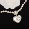 Modestil toppkvalitet dropphjärta örhänge med diamant och vit färg för kvinnor bröllop smycken gåva har lådans stämpel PS3960