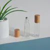10mlの透明なガラスローラーボトル天然竹の木製の蓋付き化粧品エッセンシャルオイルロールチューブパッケージングバルク4091645