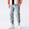 Streetwear Moda Dżinsy Mężczyźni Łądziany Designer Casual Denim Spodnie Cargo Stripe Patchwork Hip Hop Joggers Harem Spodnie WFQR