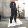 マンフィットネスハーレムパンツファッショントレンドスポーツカジュアルヒップホップスリムスポーツズボンデザイナー秋の男性ハイストリートランニング貨物汗