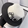 ブランドデザイナーキャップフラワーバケツ帽子の男性女性フィットパール帽子ワイドブリムチェックカジュアルファッションストローグラスブレードサン夏56-58cm