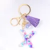 Fashion Letter Alphabet Crystal Arylic Vätska Keychain Kvinnor Nyckelkedjor Ring bilväska Tassels Pendent Charm Presentbord