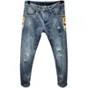 Pantalons pour hommes printemps et été brodés Jeans percés mode tendance coréenne Slim Fit Small Foot YOUTH