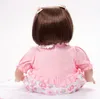 22インチのシリコーン笑顔の生まれ変わった赤ちゃんのおもちゃ手作り生まれた女の子人形見る本物の赤ちゃんが生まれ変わった子供の誕生日クリスマスギフト
