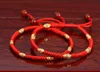 Braccialetti con portafortuna benedetti per coppie femminili con corda rossa, bracciale con perline dorate con uomini e donne