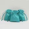 50 pcs empacotamento de jóias exposição de veludo saco de cordão verde flanela camurça chique pequenas bolsas de embalagem brincos anel colar