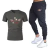 Mens Pattern Printing Tracksuit Fashion Trend Round Neck Short Sleeve Tops Slim Trousers Suits Designer Male Casual Gyms Fitness Two Pieces Sets