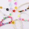 Boho kleurrijke smiley kwaad oog sleutelhanger sterren kralen nieuwe ontwerp parel ster klei sleutelhanger creatieve tas hanger accessoires sieraden