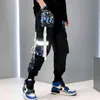 2021 Moda Swag Streetwear Erkekler Yansıtıcı Hip Hop Gevşek Kargo Pantolon Erkek Joggers Grafiti Şerit Keten Pantolon Techwear Pantolon H1223