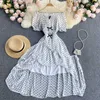 Svart / vit polka dot oregelbunden lång klänning Sexig Slash Neck Puff Sleeve Hög midja Ruffle Vestidos Vacation Beach Robe Sommar Ny Y0603