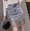 Skirts High End Luxury Sequin Embroidery Stitching Denim Skirt European Station Elegant Bead Piece Tassel Hip Package Sexy Waist